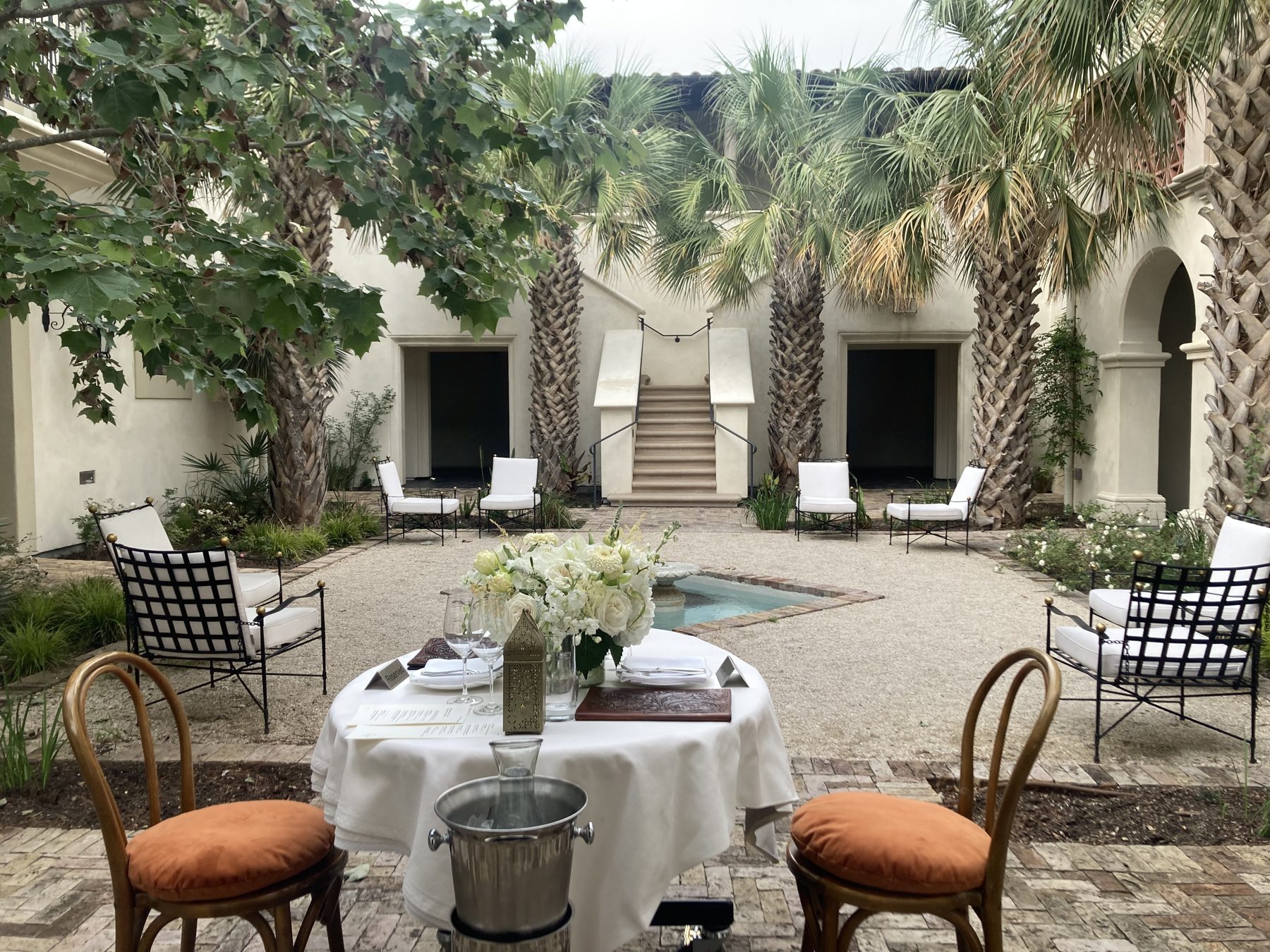Courtyard table set for dinner