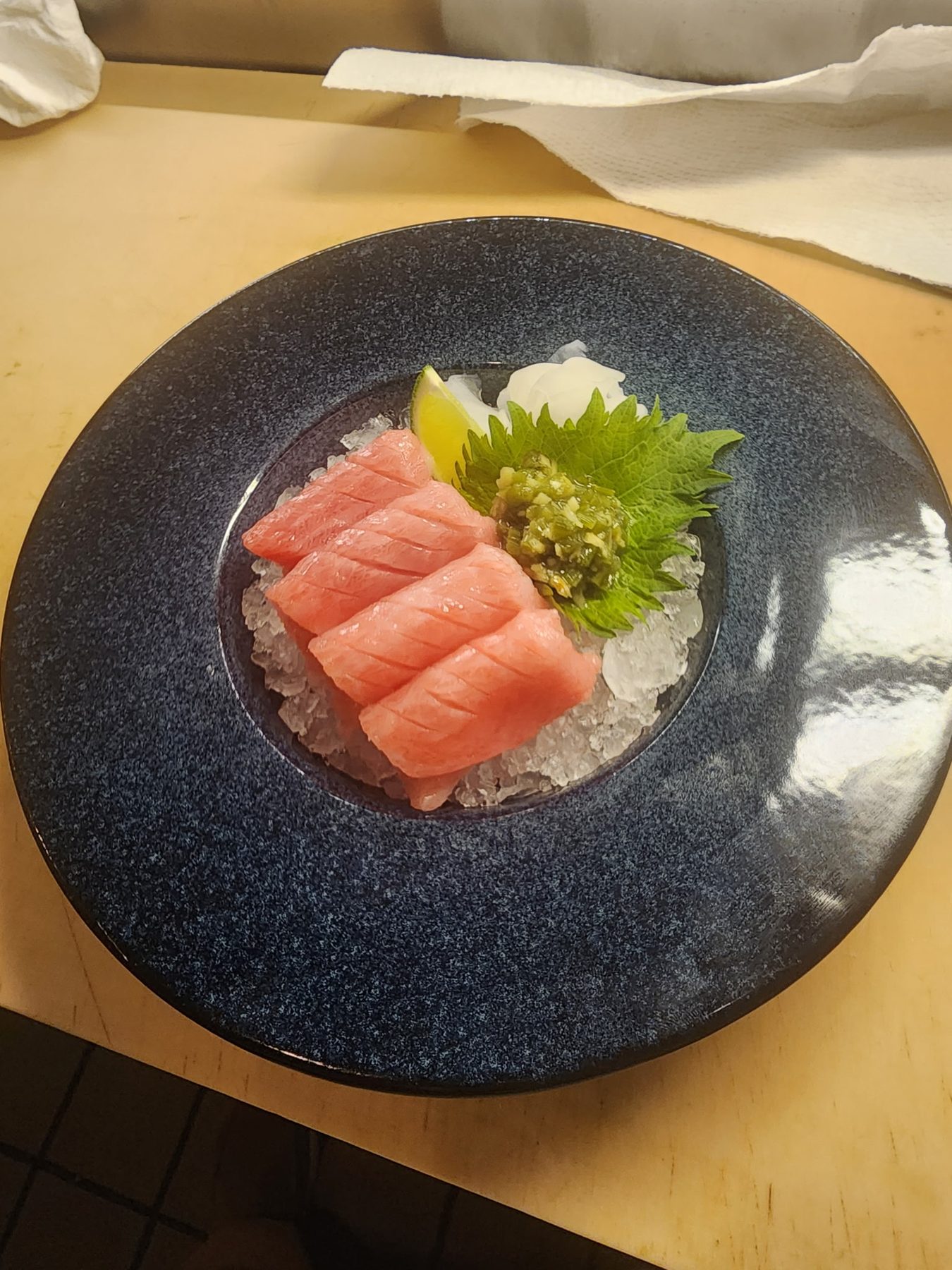 Chutoro sashimi on dark stone